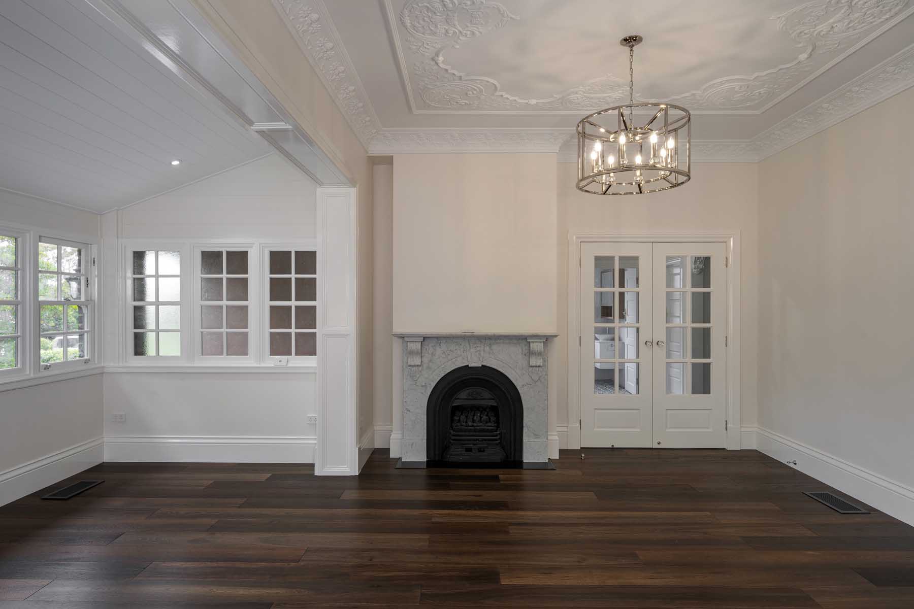 Living room renovation, open fireplace, timber floorboards